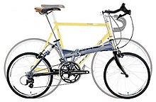 Overlaid photos of two KHS bicycles, one a F20 510 mm (20 in) wheel folding bicycle and the other a Flite 100 700c (622 mm) wheel racing bike, showing similarities in the geometry and riding position. Khs overlay.jpg