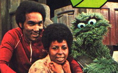 Miller as Gordon, with Long as Susan and Caroll Spinney as Oscar the Grouch. Undated publicity photo, likely from 1972.