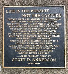 A memorial of Anderson located in downtown Duluth's Leif Erickson Park, detailing a passage from his 1990 book Distant Fires