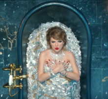 The bathtub scene in the music video. The diamonds used were said to be authentic and worth over $10 million, and a lone dollar bill can be seen. Taylor Swift - Look What You Made Me Do (music video screenshot).png