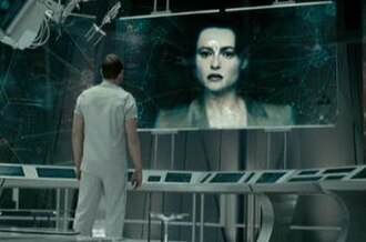 Helena Bonham Carter as Skynet, under the guise of the late Dr. Serena Kogan on a monitor, with Sam Worthington as Marcus Wright