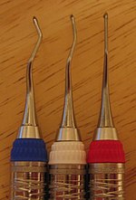 Gracey curettes have sharp cutting edges on only one side of their blades. There are two site-specific Gracey curettes - posterior mesial (white ring) and posterior distal (blue ring), in addition to the anterior curette (red ring). Gracy currettes.JPG