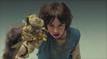 The child who is the central focus of the music video. BMTH - Throne screenshot.png
