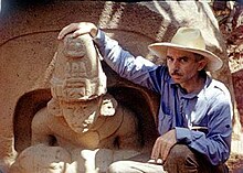 Matthew Stirling posing with the primary figure from Altar 5. This photo effectively shows the sheer size of the altars. (For a full view of Altar 5, click here.) This is a still from the Smithsonian Institution's Exploring Hidden Mexico (1943). Matthew Stirling, 1943.jpg