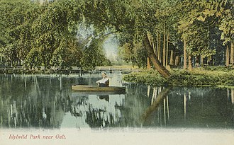 Man piloting a jon boat on the Speed River within Idylwild Park IdylBoat.jpg