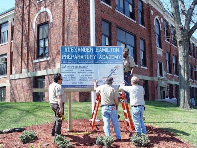 Alexander Hamilton Preparatory Academy sign being placed in early 2008.