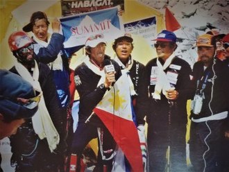 Leo Oracion, the first Filipino to reach the summit of Mount Everest, answers questions from media partner ABS-CBN via satellite communication, after his successful summit attempt on 17 May 2006. First Philippine Mount Everest Expedition Team, May 2006.jpg