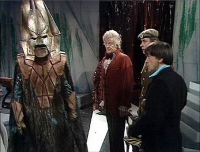 Omega explains things before two of the three Doctors and Sergeant Benton.