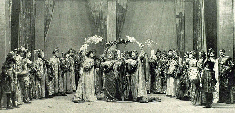 Ellen Terry's silver jubilee celebrations, 1906. She is on the right in the group of three, centre stage, with her sisters Marion and Kate. Fred is at the far right, his young son Dennis, stands near him in the foreground. All others on the stage are also members of the family. Ellen-Terry-jubilee.jpg