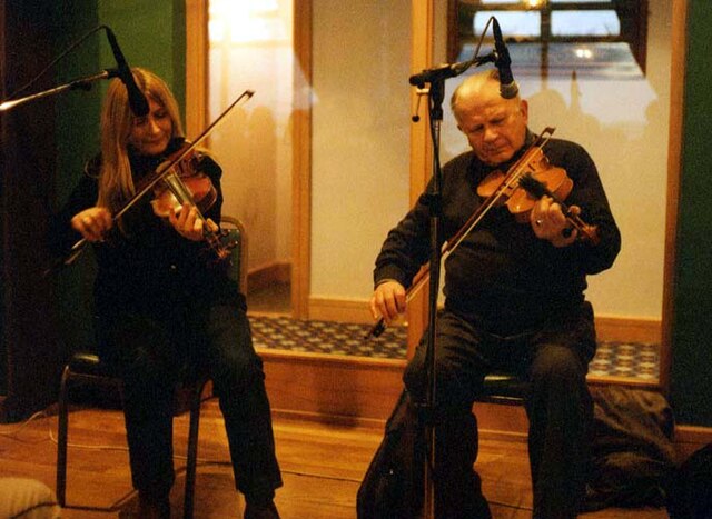 Ní Mhaonaigh performing with her father.