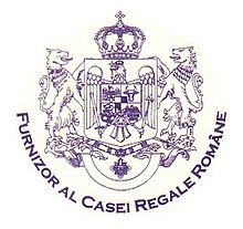 The wording reads: Purveyor to the Romanian Royal House, used since 2003 (and probably between 1923 and 1947) Furnizor al Casei Regale Romane - 2003.jpg