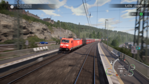 A German DB BR 185 freight train passes Partenstein station on the Main-Spessart Bahn. TrainSimWorld trainview.png