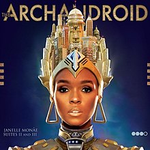 Image of an African American female shoulders up with headgear consisting of multiple buildings and sculptures whilst wearing large triangular earrings she looks into the camera with robotic style metallic shoulder-wear. The background of the image is blue with it darkening away from her head with the title placed across the top of the cover and her name and the words 