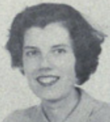 A smiling young white woman with short dark hair