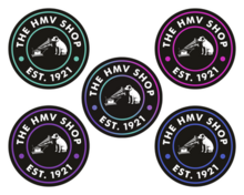 Examples of the alternate 'round' logo used at shops since 2021 (the colour varies depending on location) HMV store signs (multicolour).png