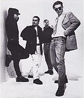 A promotional photograph of the Madness, (L-R): Thompson, Foreman, Smash, and Suggs The Madness Band.jpg