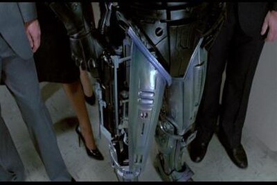 RoboCop holstering weapon