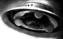 Adamski's infamous chicken brooder photograph, which he claimed to be of a UFO, taken on 13 December 1952. However, German scientist Walther Johannes Riedel said this photo was faked using a surgical lamp and that the landing struts were General Electric light bulbs.