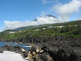 The coast along São João, showing village, looking towards the summit of Pico, in the west