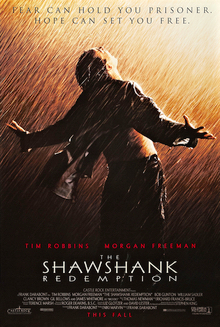 A man stands with his back to the viewer and his arms outstretched, looking up to the sky in the rain. A tagline reads "Fear can hold you prisoner. Hope can set you free."