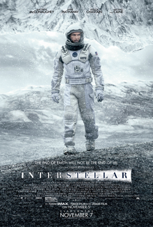 An astronaut on a cold mountain setting with snow falling with another mountain as a ceiling. Four of the actors names appear on the top, with a headline reading 