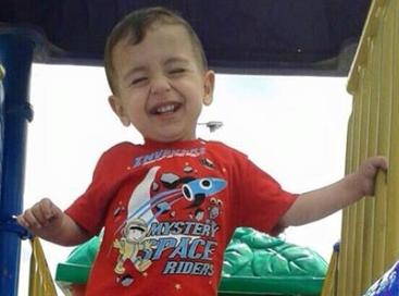 پرونده:Alan kurdi smiling playground.jpg