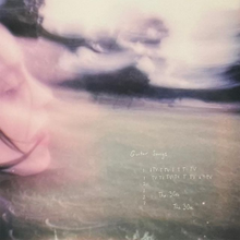 Cover art for Guitar Songs: a washed-out photo of Billie Eilish on a field of grass