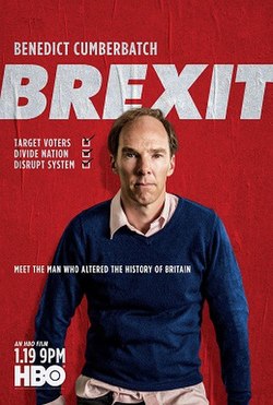 A balding man in a blue jumper, his untidy shirt sticking out at the edges. He standings against a red background, with the word Brexit in large white letters.