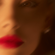 Cover art of "Yes, And?": a defocused picture of the left side of Grande's face