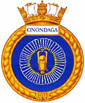 Emblema do HMCS Onondaga: um wampum (pulseira) azul com contorno dourado.  O centro consiste em uma cabeça de taco.