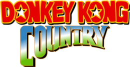 Donkey Kong Country ist in zwei Zeilen geschrieben, die erste mit roten Buchstaben, die mit Gelb umrandet sind, und die andere in einem doppelten Farbverlauf von hellgrün nach blau nach weiß.