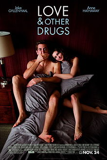 Jamie (Jake Gyllenhaal) and Maggie (Anne Hathaway) are in torn blankets in bed, as information is below and "Love and Other Drugs" is at the top.