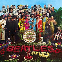 A colour image of the Beatles, holding marching band instruments and wearing colourful uniforms, stand near a grave covered with flowers that spell "Beatles". Standing behind the band are several dozen famous people.