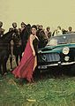 1960: l'attrice Rossana Podestà appoggiata al cofano di una Flaminia Coupé in una pausa delle riprese del film "La schiava di Roma"