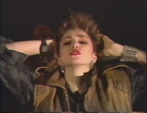 Мадонна в видеоклипе «Everybody». Видео помогло развеять слухи о том, что она была афроамериканской певицей.