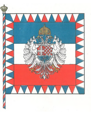 Краљева стандарта. Како је описана у публикацији „Grbovi, zastave, drugi državni amblemi i zvanični znaci Kraljevine Jugoslavije [...]” од 1936. године: „Краљева Стандарта претставља државну заставу са бордуром, коју сачињавају троуглови обојени бело, плаво и црвено. На застави, у средини, двоглави бели орао са круном и штитом из грба Краљевског Дома. Копље, на врху, има круну.”[127]