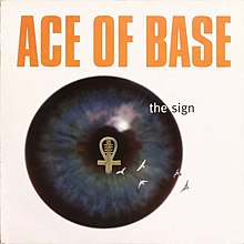 A close-up shot of an eyeball with an ankh inside. The text above reads Ace of Base – The Sign