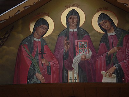 Зображення Дрогобицьких священномучеників Северіяна, Якима та Віталія над входом в церкву Дрогобицьких священномучеників