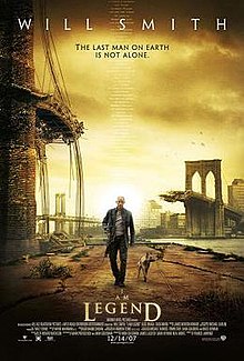 A man wearing leather clothes and holding a rifle walks alongside a dog on an empty street. A destroyed bridge is seen in the background. Atop the image is "Will Smith" and the tagline "The last man on Earth is not alone". Below are the film's title and credits.