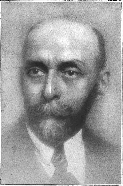 Portrait de René Boylesve, en col blanc et cravate, moustache et barbiche.