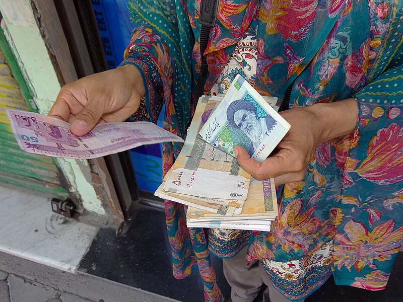 File:Visitor (Griselda Ramirez) Holds Freshly-Acquired Iranian Currency - Downtown Ardabil - Iranian Azerbaijan - Iran (7421182372).jpg