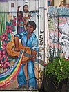 Guitar man mural on Balmy Alley